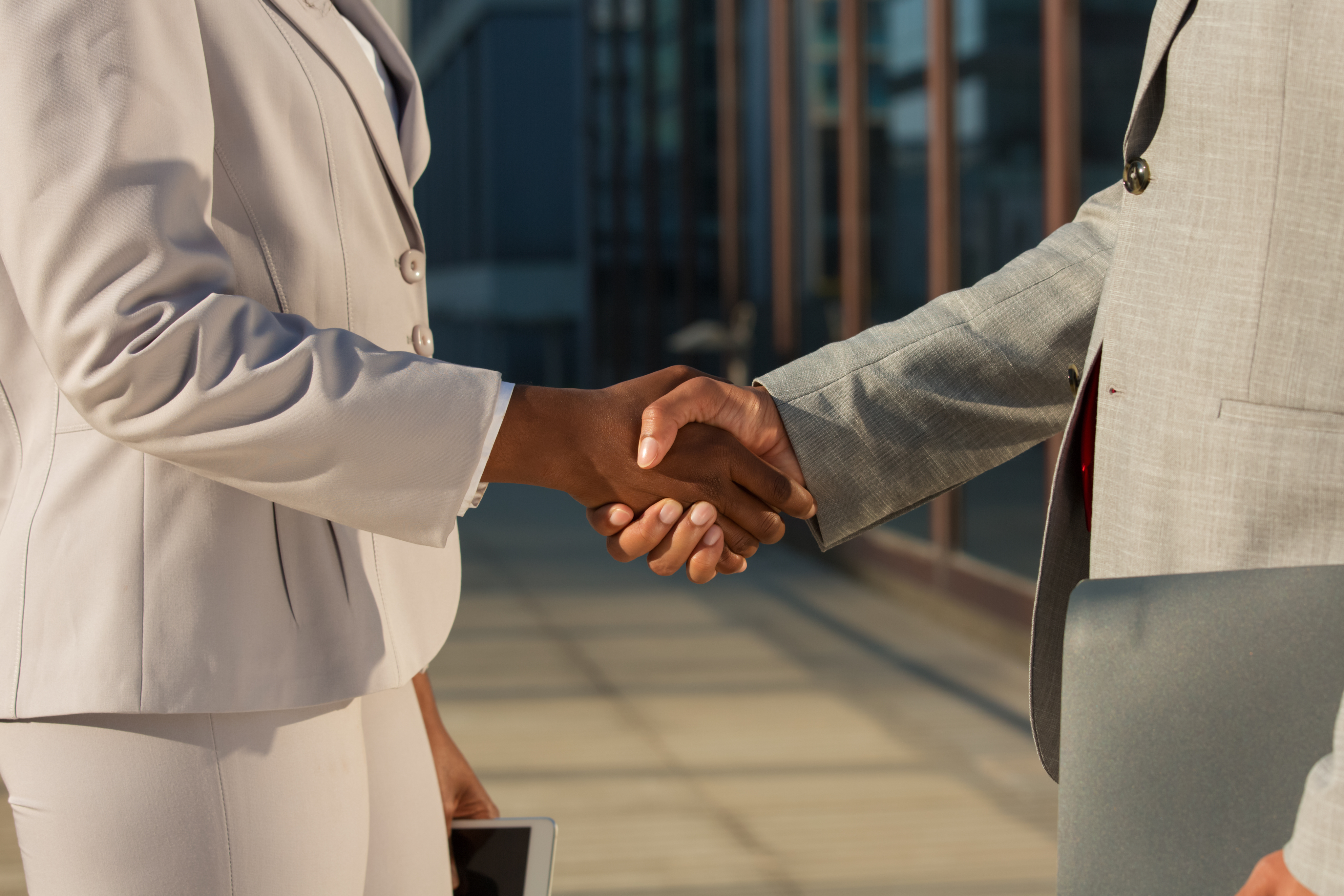 Business handshake representing sponsorship