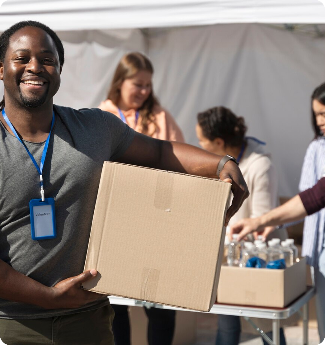 Volunteer holding box