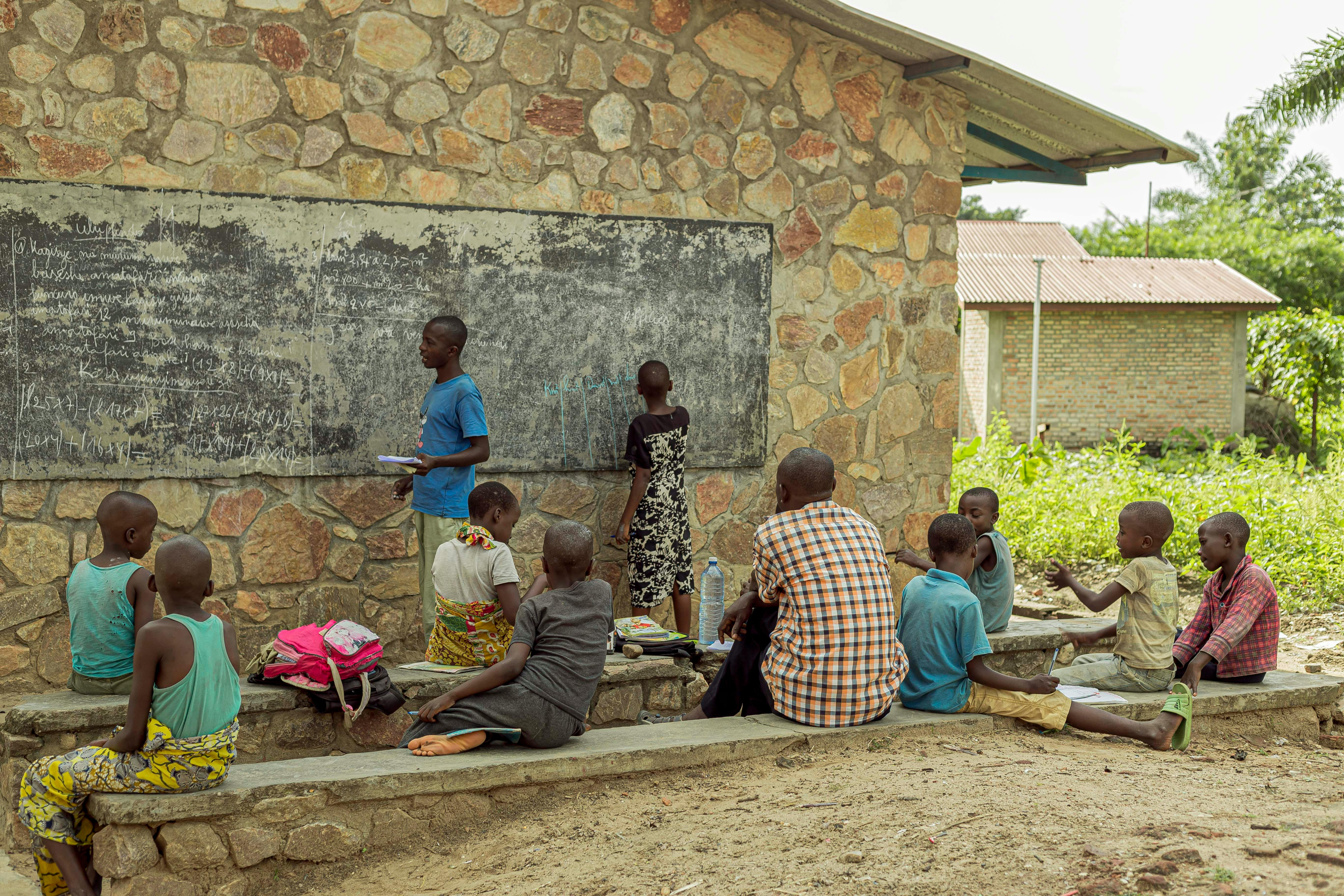 Children learning in an outdoor classroom in Africa